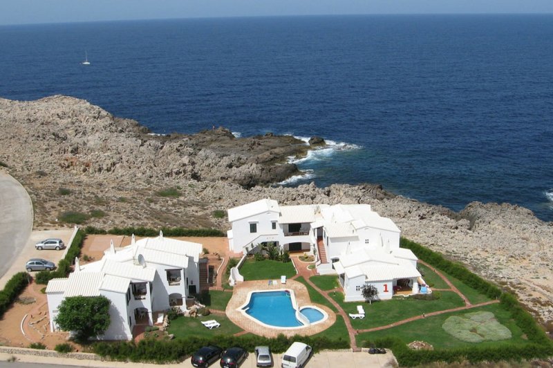 View of the Rocas Marinas apartments from the air, on the coast of Menorca.