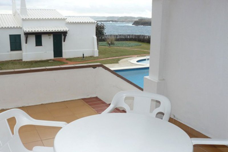 Terrace of the Rocas Marinas 6 apartment with stairs to the pool.