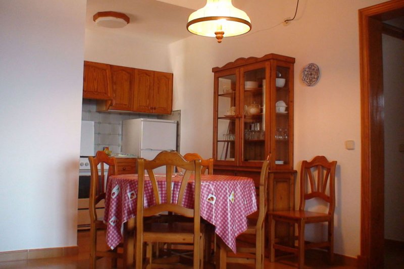 Part of the living room and kitchen of the Rocas Marinas 4A apartment.