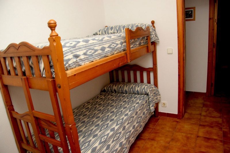 Dormitori amb lliteres de l'apartament Arco Iris 5.